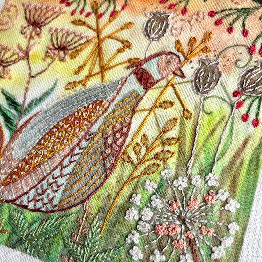 Embroidered fabric with floral and bird design